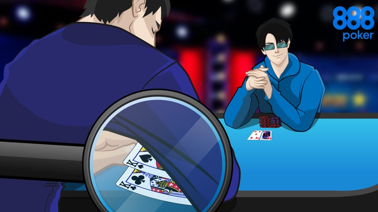 Poker player sitting at a table and can see he holds pocket kings