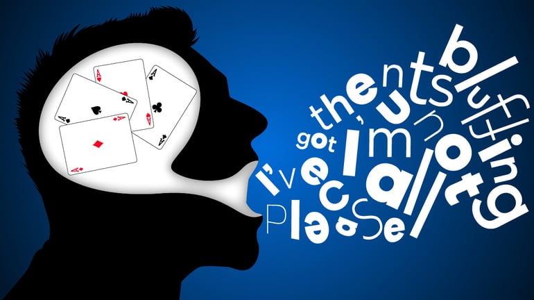 Poker player’s head with Aces inside and the words