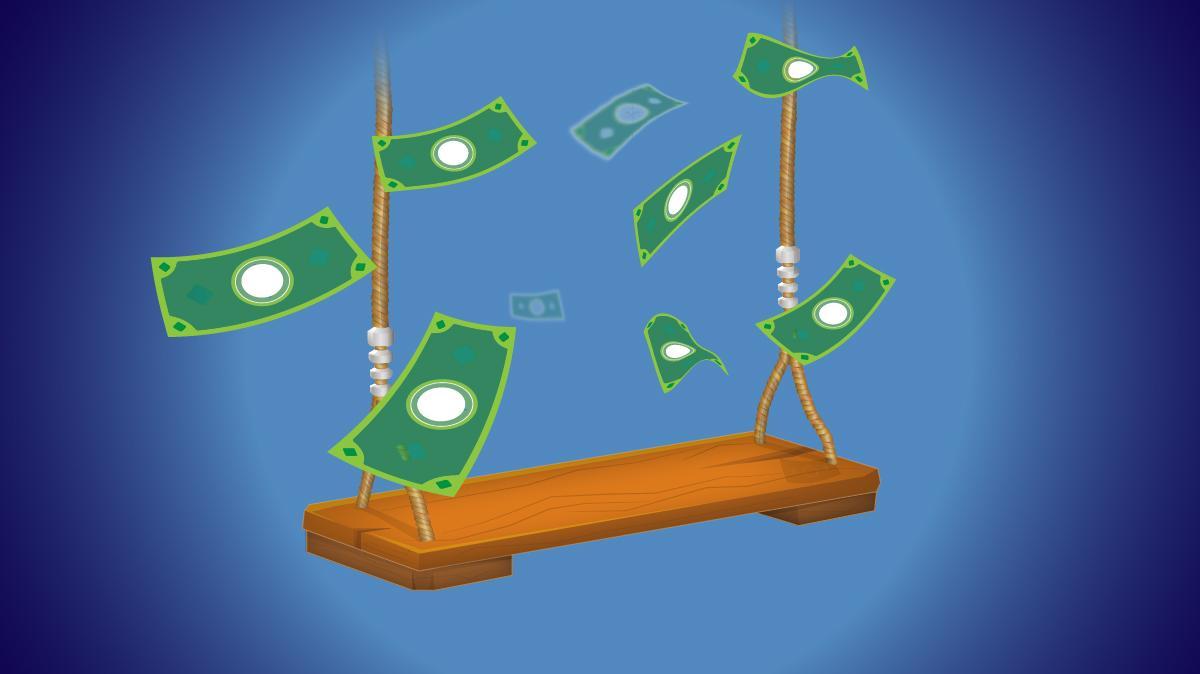 Swing with dollar bills flying in the air