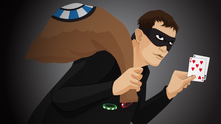 burglar with 7-2 cards in hand and bag over shoulder filled with poker chips.