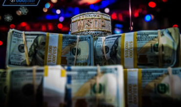 wsop bracelet over a stack of us dollar bills